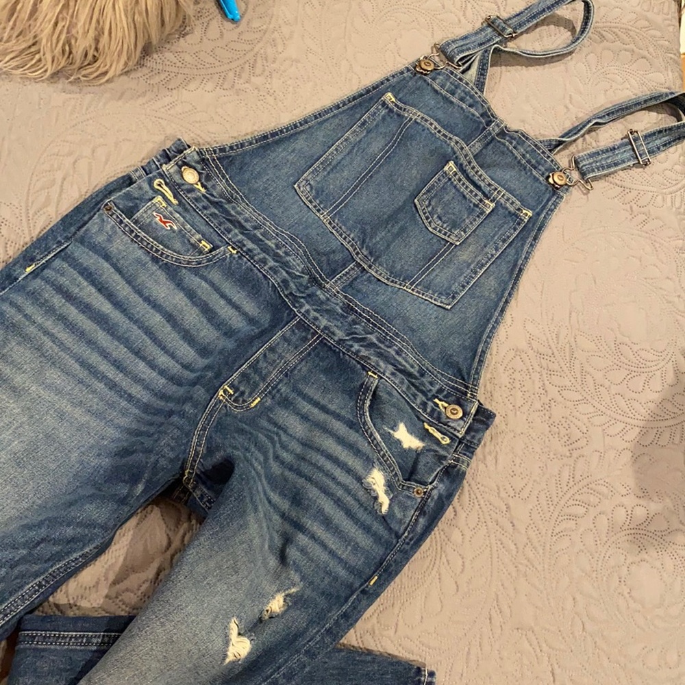 Distressed denim overalls